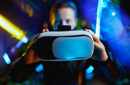 Closeup on woman in virtual reality showing vr goggles.